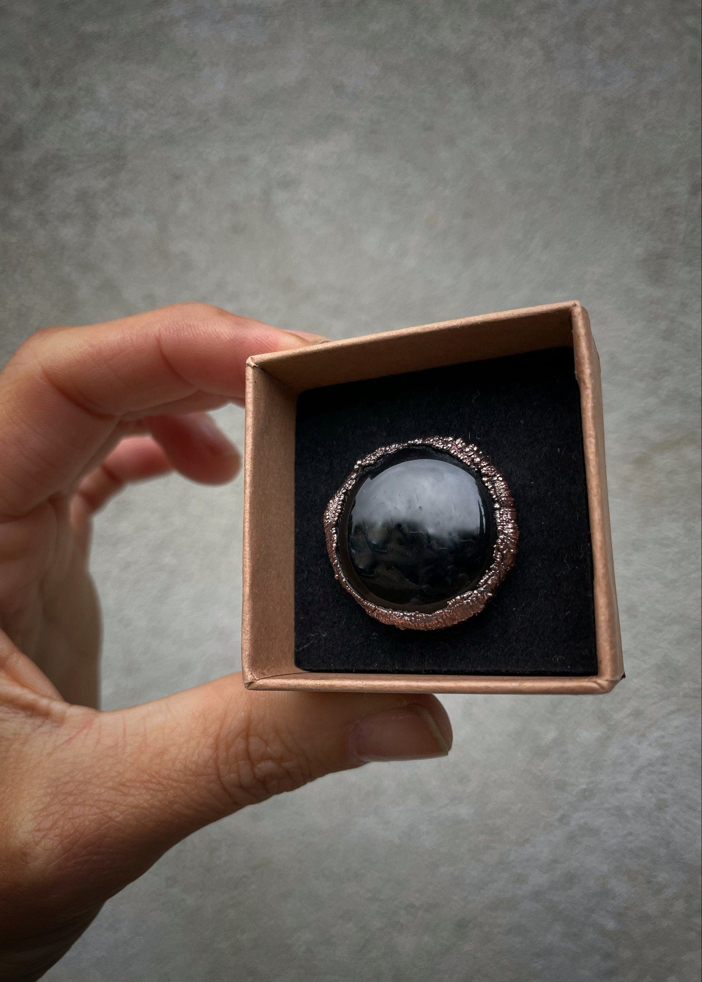 Ring with round black agate stone