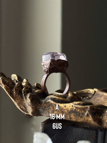 Collection of rings in kunzite, fluorite and aquamarine
