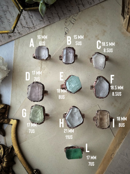 Collection of rings in kunzite, fluorite and aquamarine