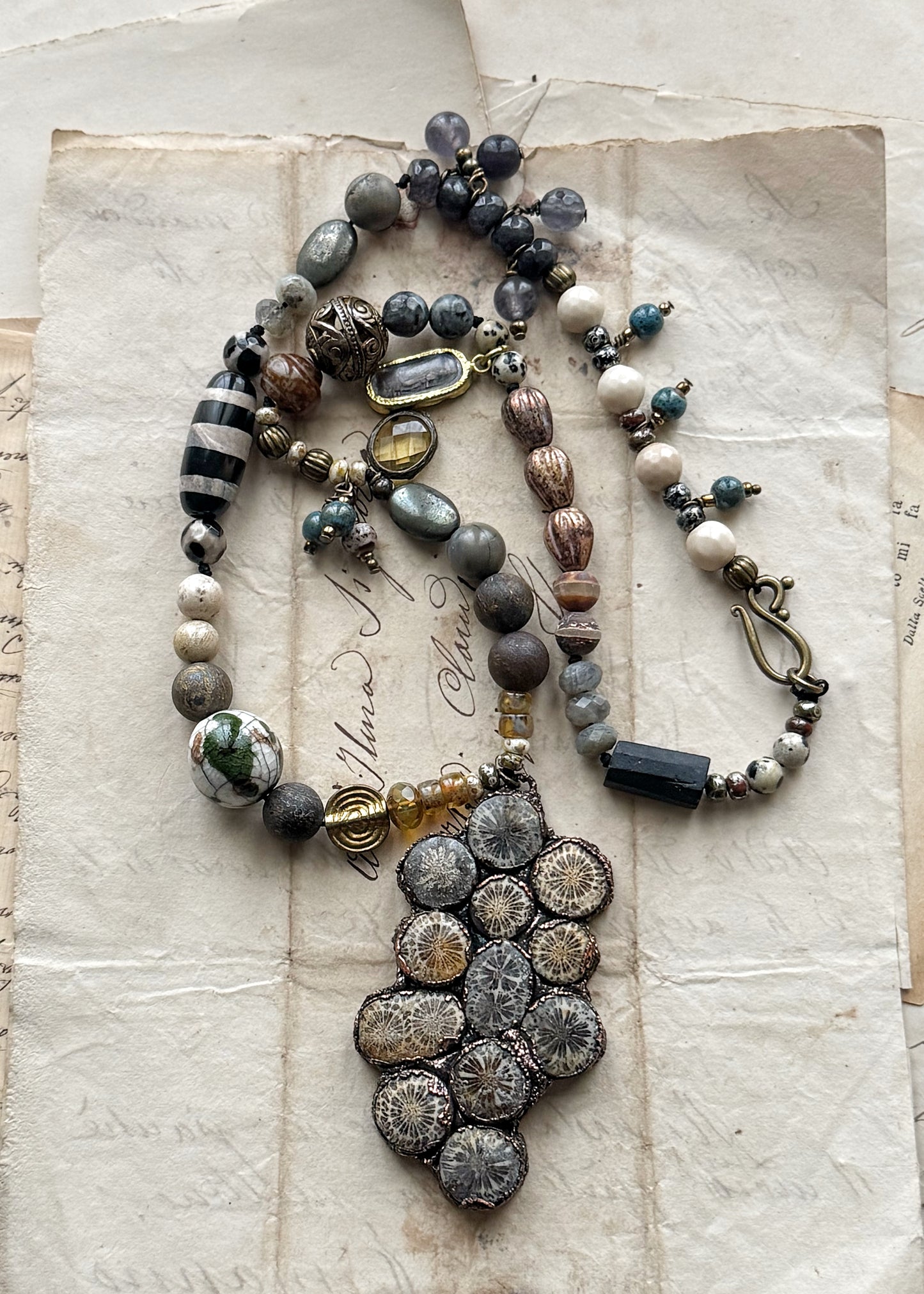 Necklace with natural stones and pendant with fossil coral