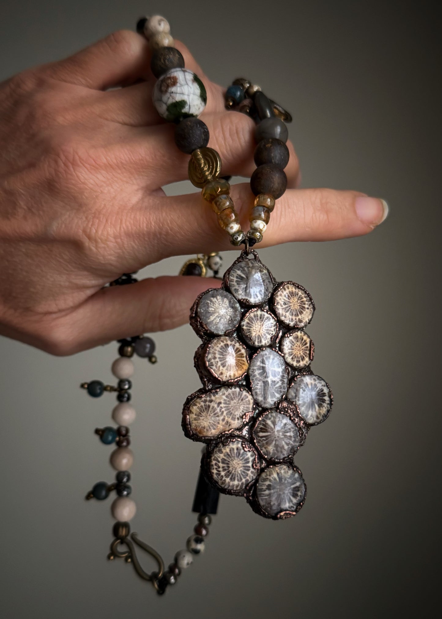 Necklace with natural stones and pendant with fossil coral