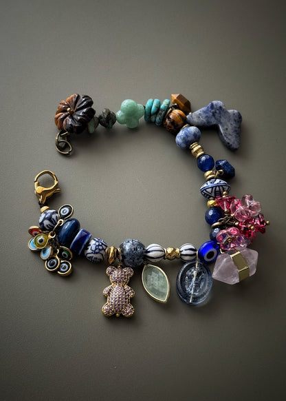 Bracelet with blue stones, flowers, teddy bears, butterflies and pendants - Model 13