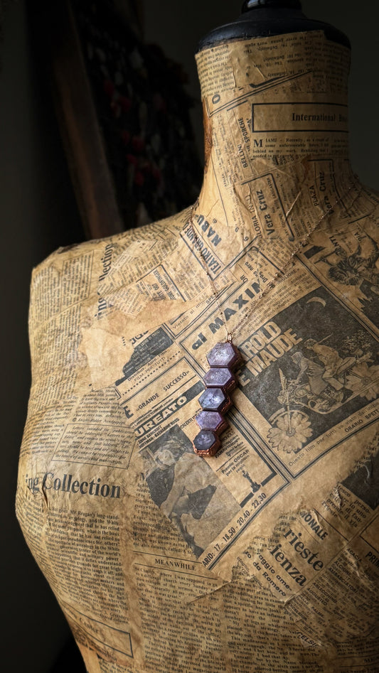 Custom-made copper pendant with ruby root