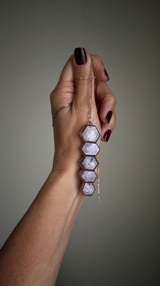 Custom-made copper pendant with ruby root