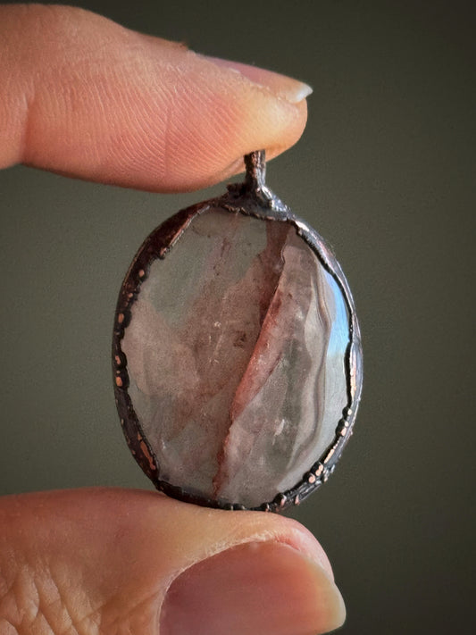 Oval pendant in hematoid quartz