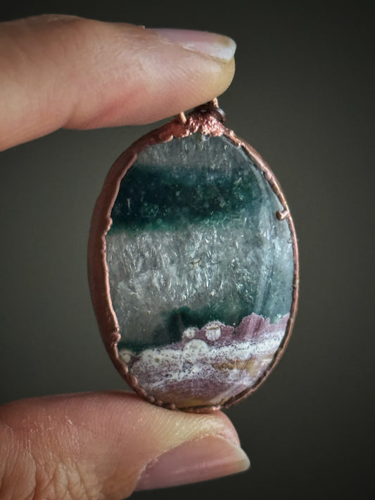 Oval pendant of Moss Agate and quartz infiltration