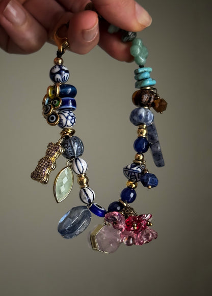 Bracelet with blue stones, flowers, teddy bears, butterflies and pendants - Model 13