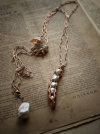 Copper pendant with five pearls in a pod