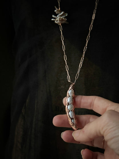 Copper pendant with five pearls in a pod