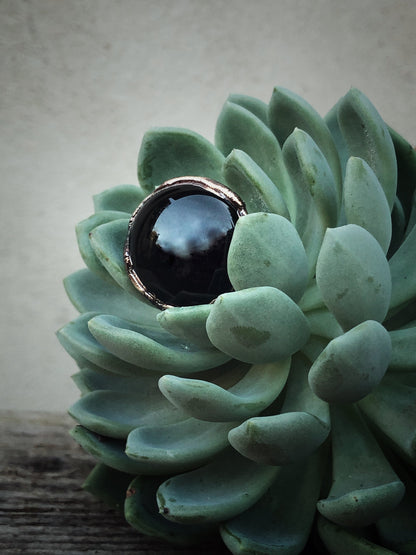 Ring with round black agate stone