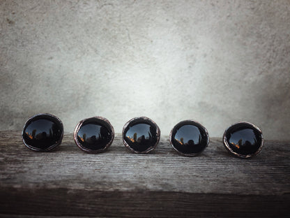 Ring with round black agate stone
