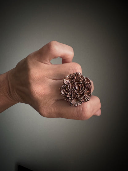 Burnished copper flower ring.