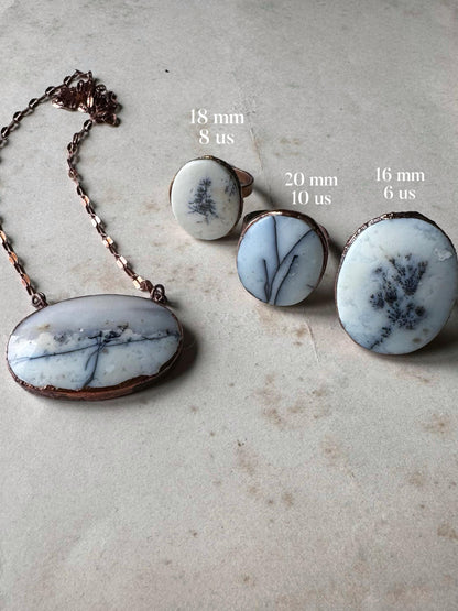 Rings with white dendritic agate stones.