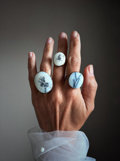 Rings with white dendritic agate stones.