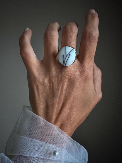 Rings with white dendritic agate stones.