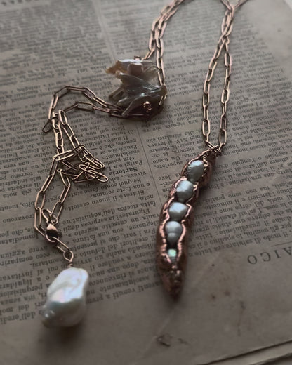 Copper pendant with five pearls in a pod